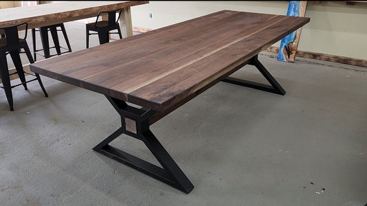 Dining table made of black walnut with metal legs